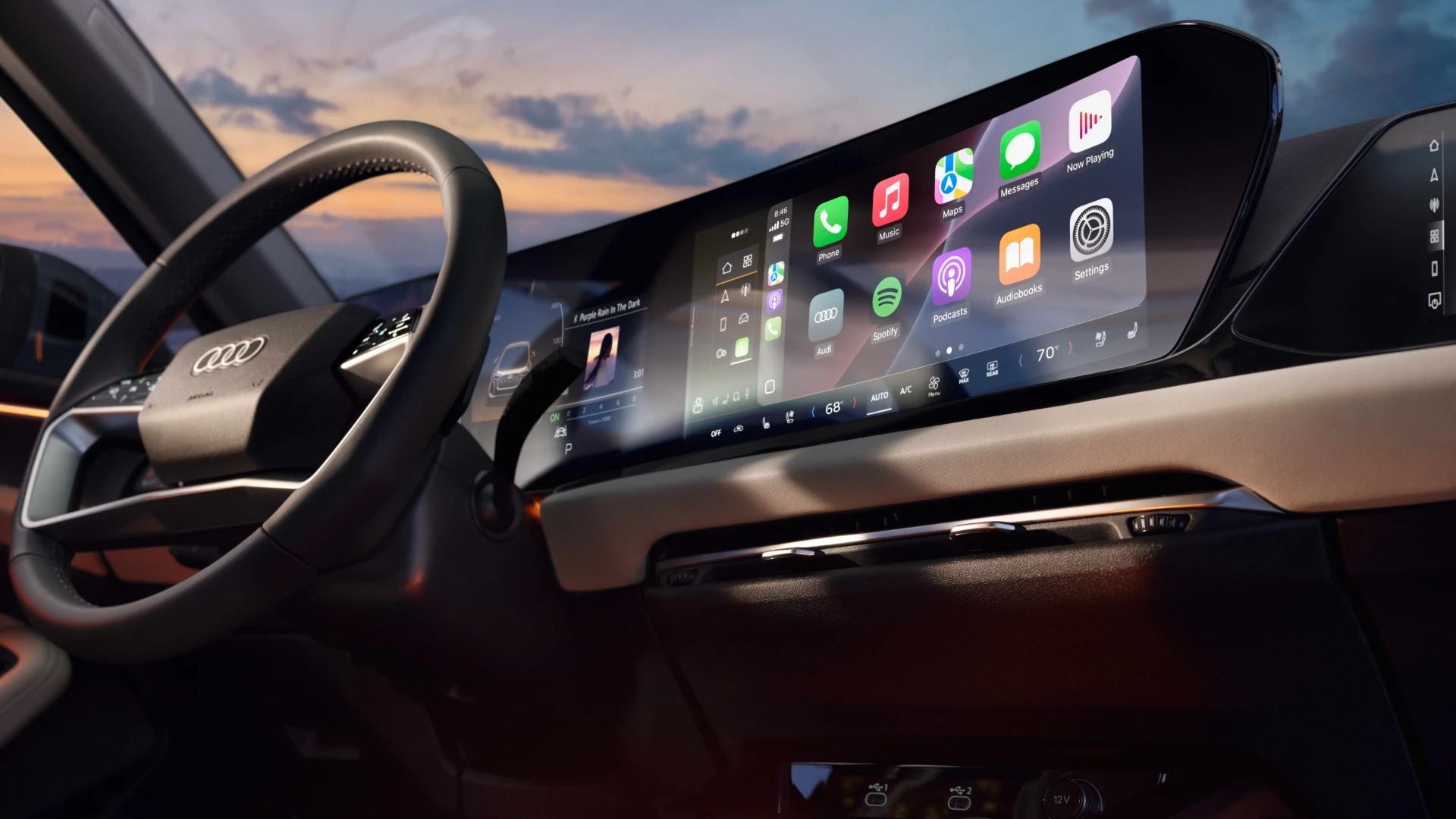 Interior view of an Audi steering wheel and dashboard.