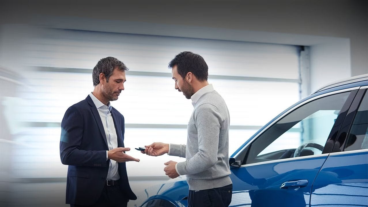 Audi sales technician working with a customer.