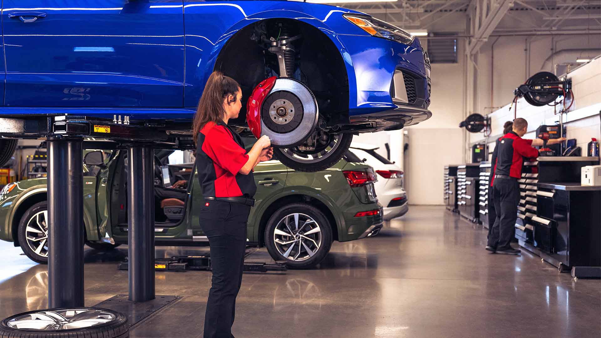 Service technician working on Audi in service shop