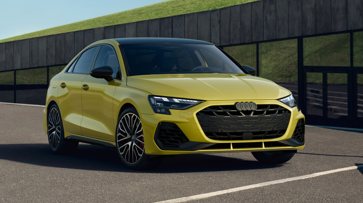 A new Audi model parked in front of a dealership