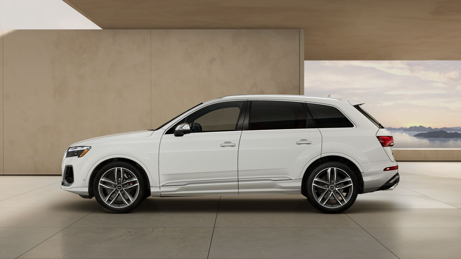 Side of an Audi white SQ7 2026, parked inside of a beige structure. 