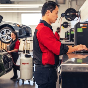 Technician working on oil change