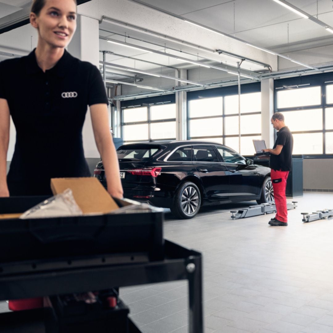 Audi tech working on a car