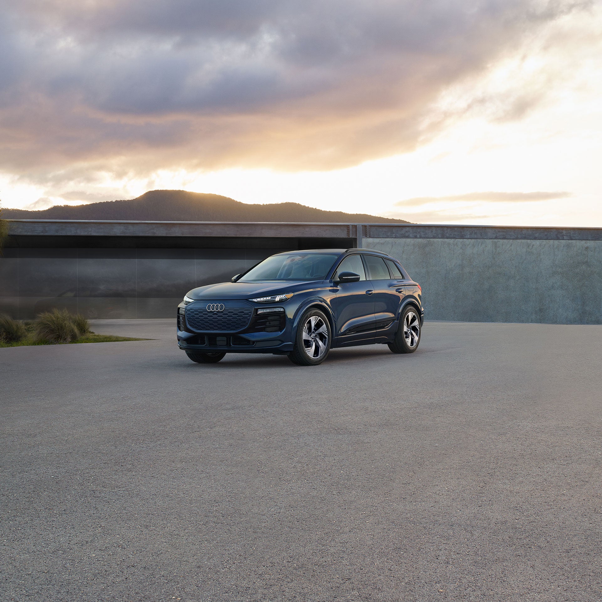Three-quarter front view of the Audi Q6 e-tron.