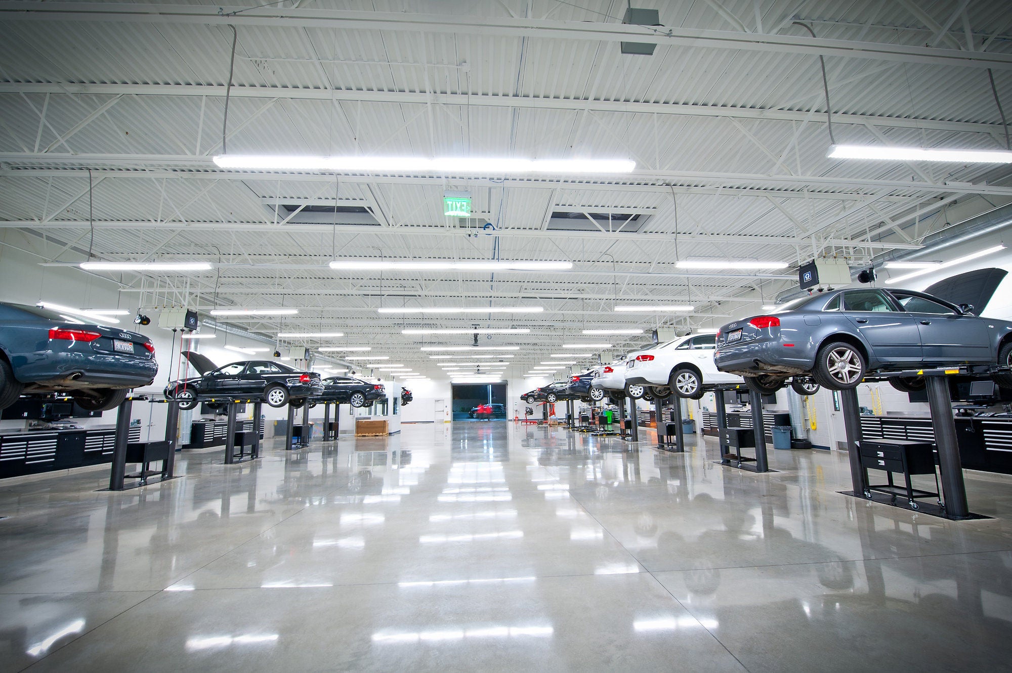 Audi Sale Specialist explaining vehicle features to a customer.