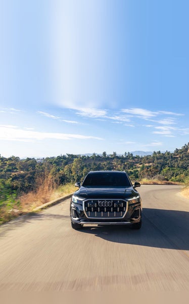 2026 Audi Q7 driving up a golden canyon road near Pittsburgh PA