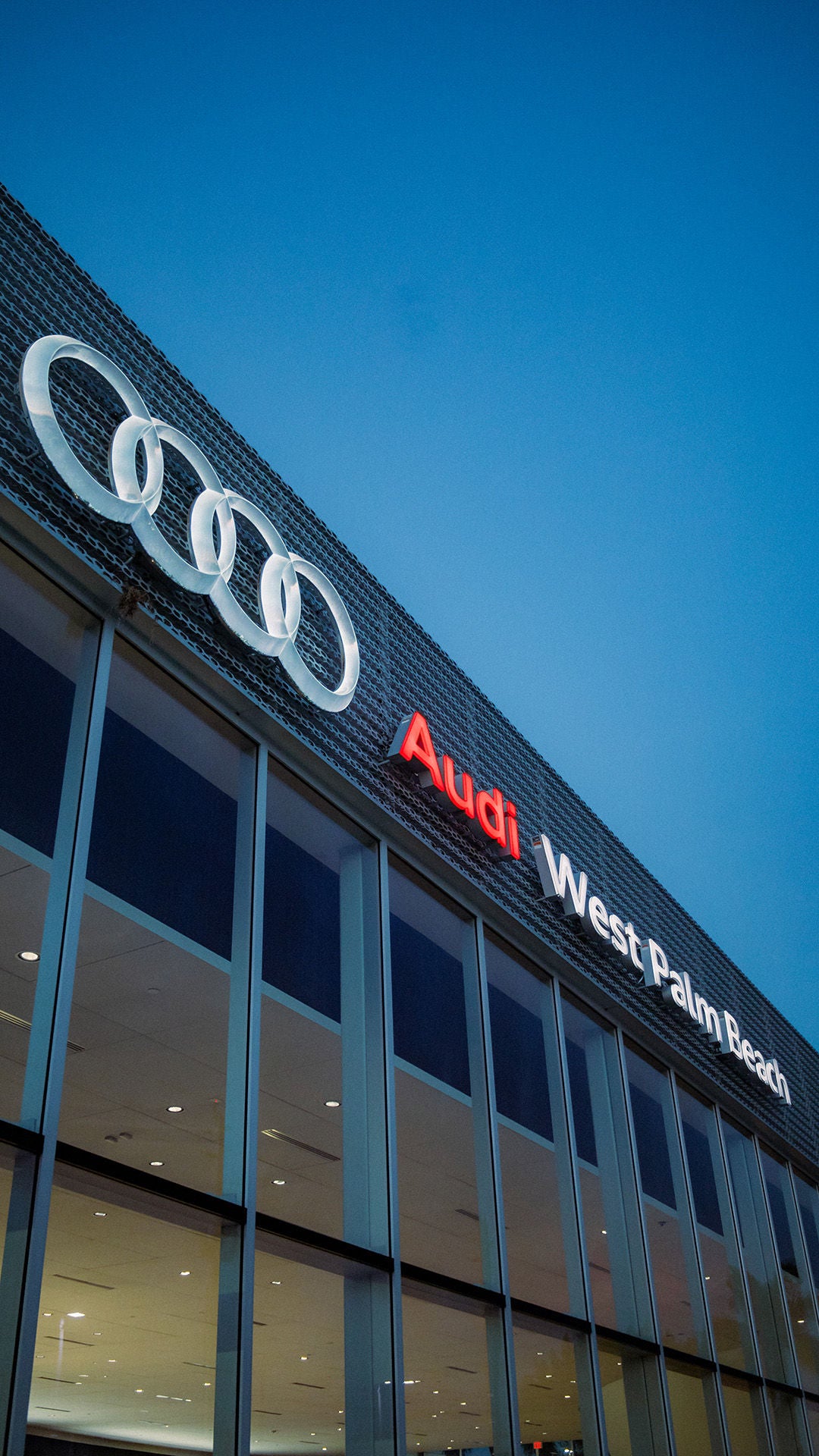 Store front of the Audi West Palm Beach dealership.