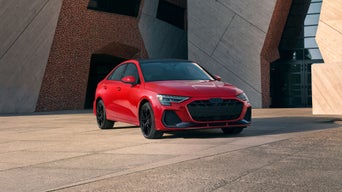 Front corner view of a red Audi A3 sedan