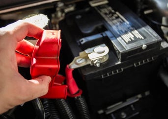 Service technician servicing battery.