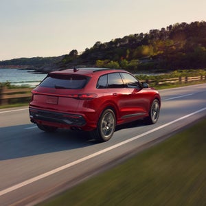 Rear 3/4 view of the Audi SQ5 in motion.