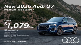 Side view of an Audi Q7 parked.