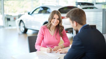 Audi representative talking to a customer. 