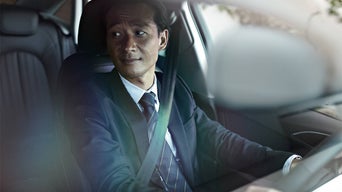 Personne assise sur le siège conducteur d’un véhicule Audi.