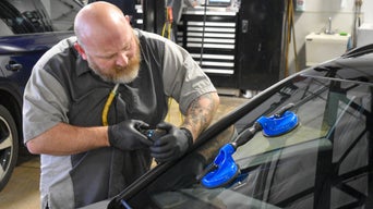 Service technician serving vehicle