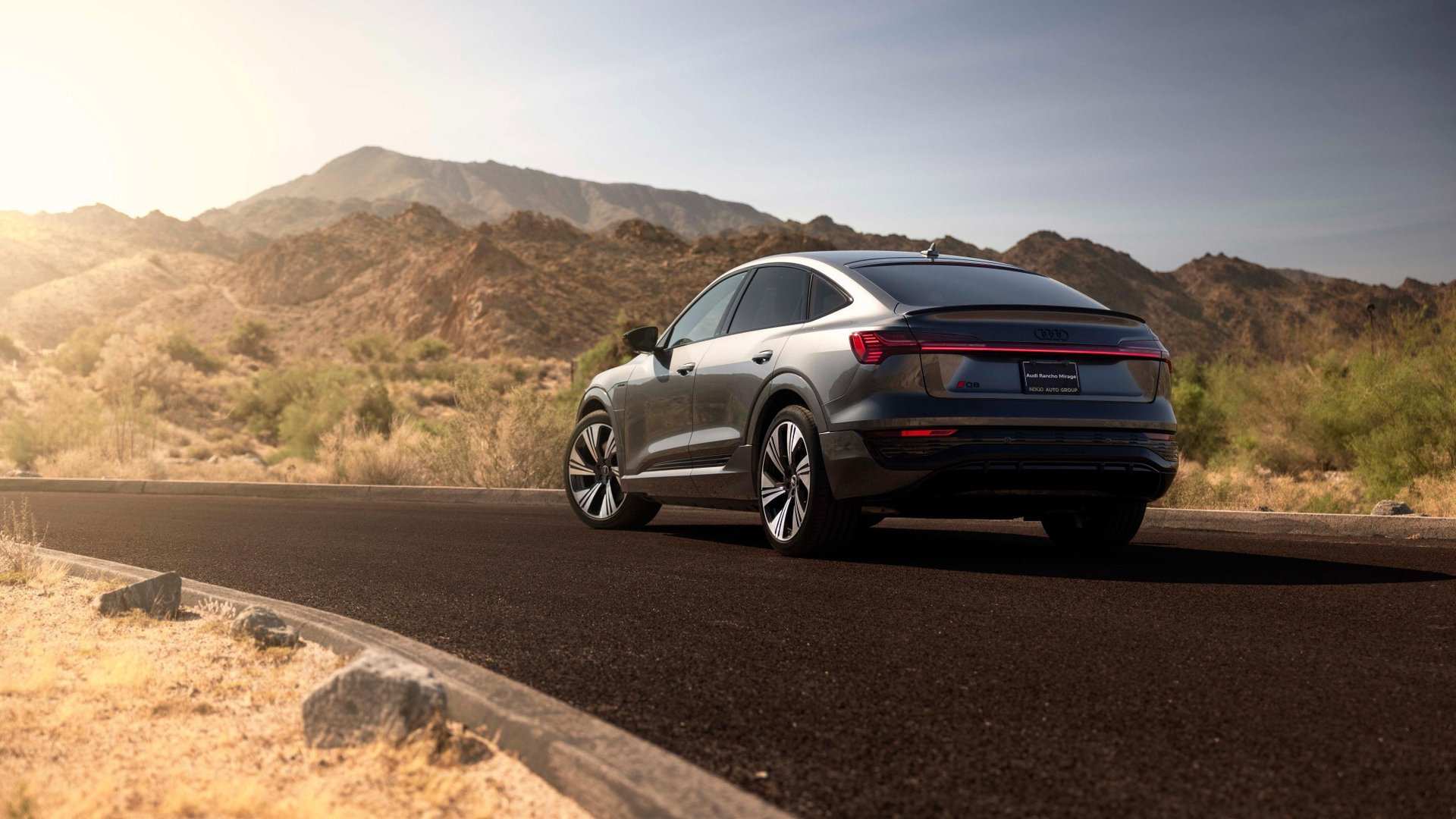 Rear profile view of an Audi Q8 e-tron parked.