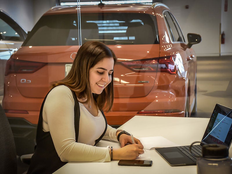 Woman working on laptop.