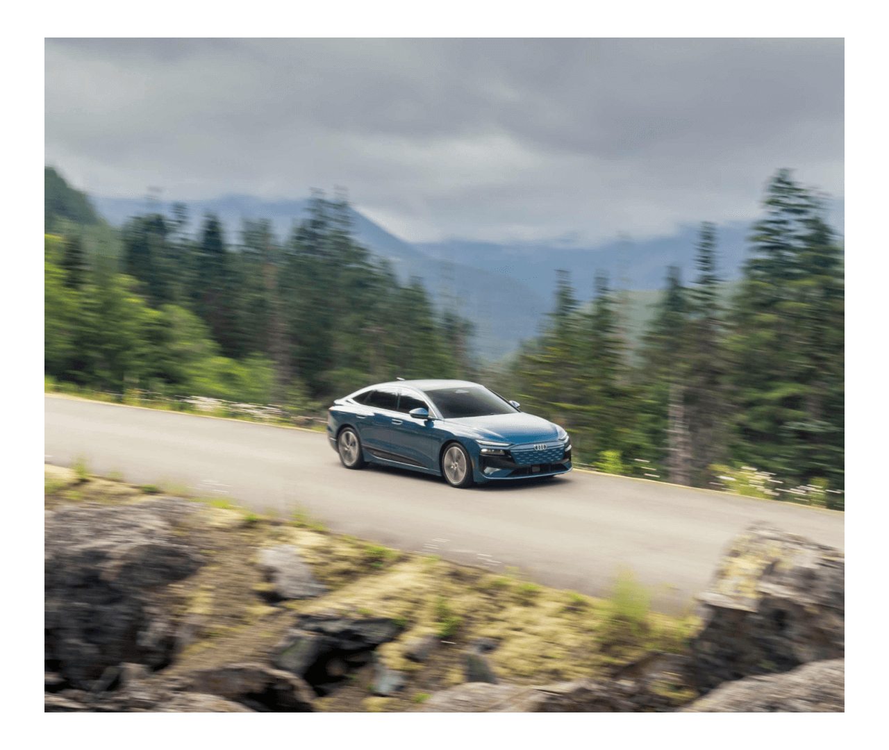 2025 Audi A6 Sportback e-tron driving through the forest