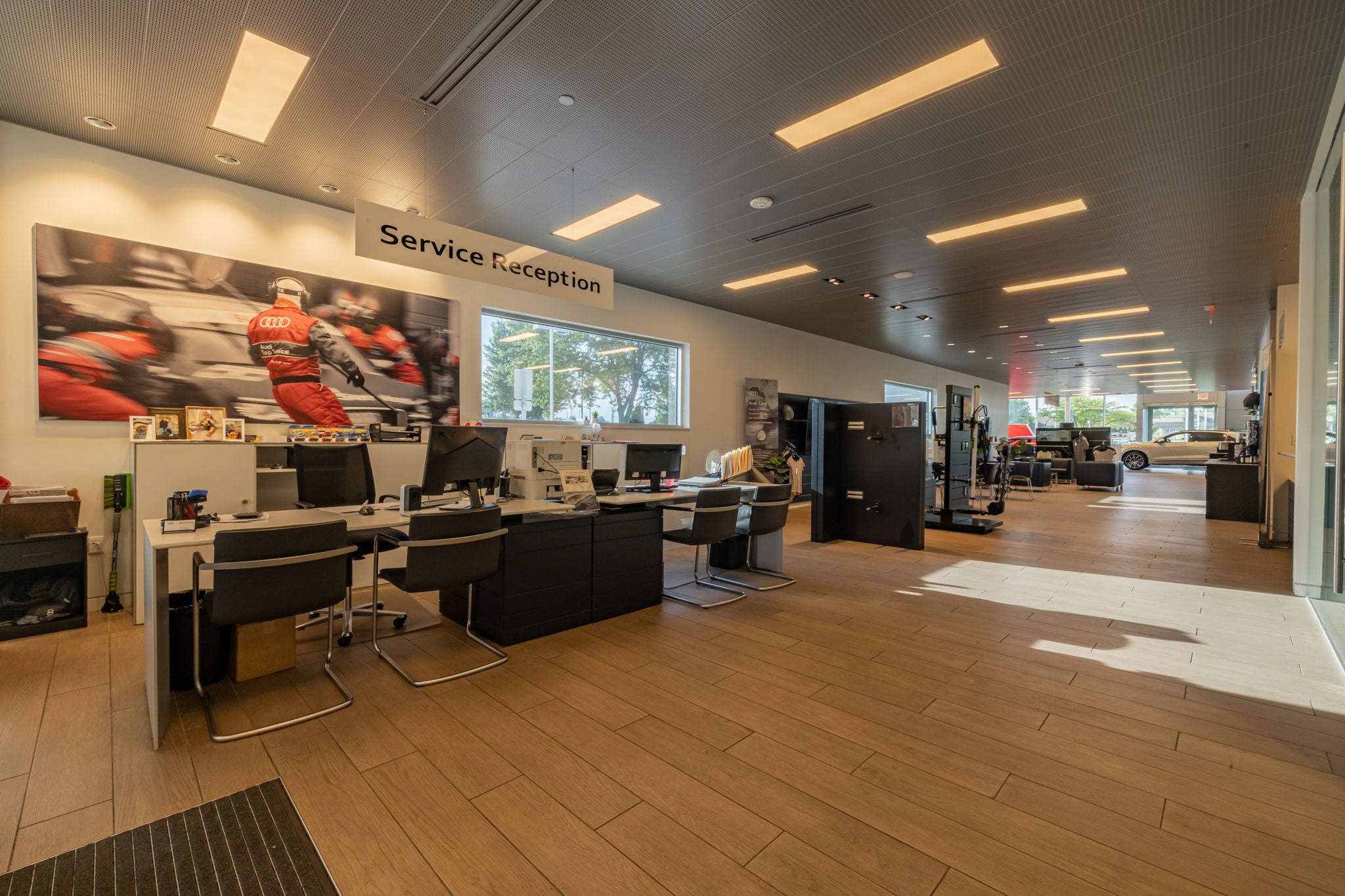 Audi service technician servicing a vehicle.