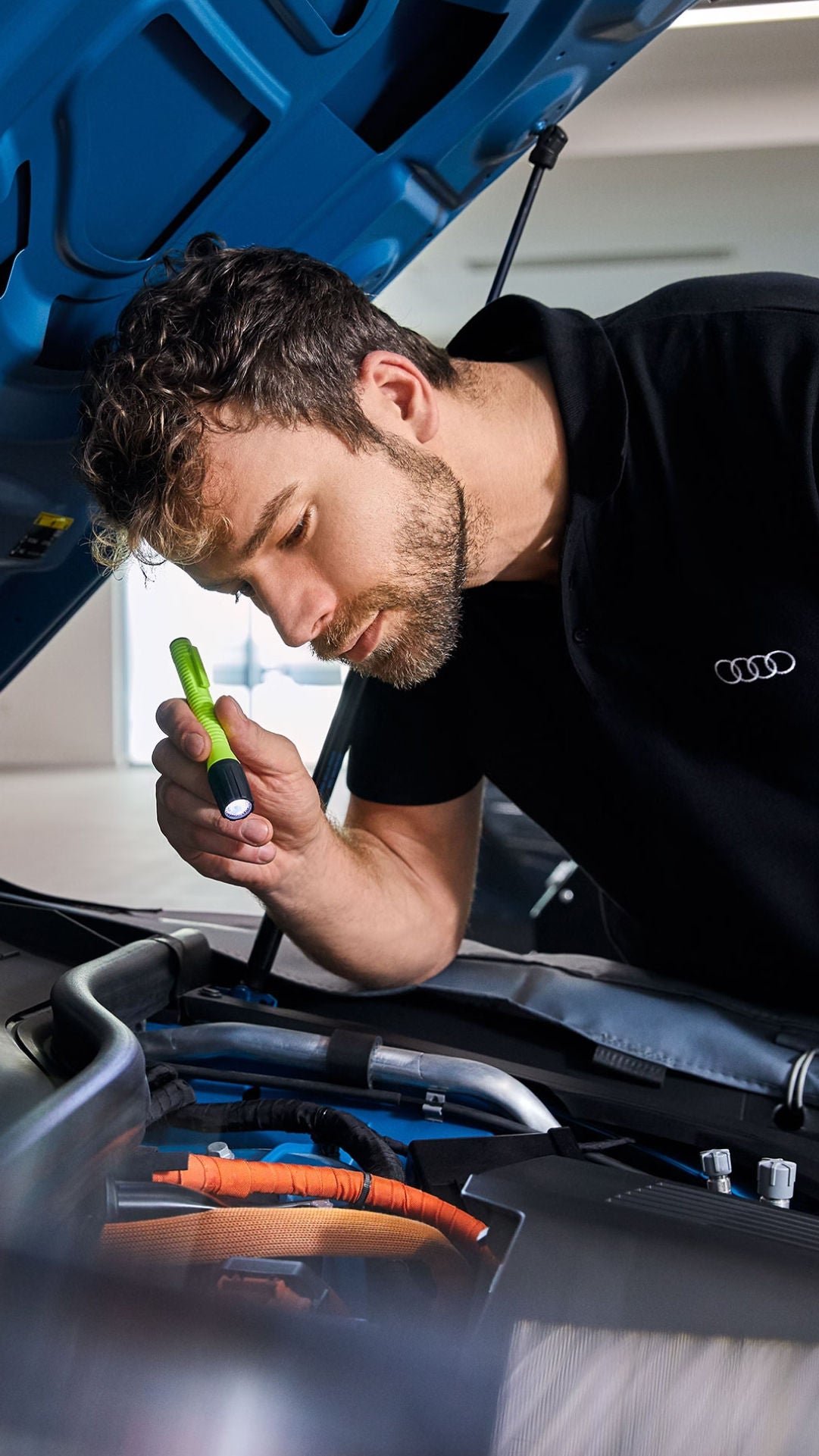 Service technician servicing a tire with another technician.