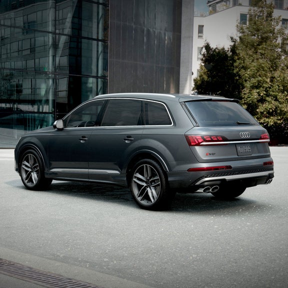Three-quarter rear view of an Audi SQ7 parked.