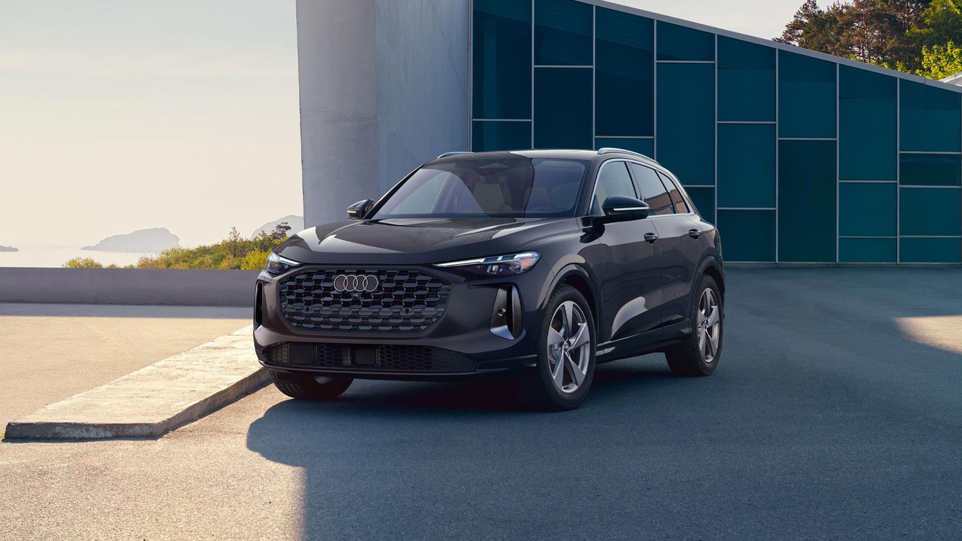 Audi Q5 parked in the shade of a wall