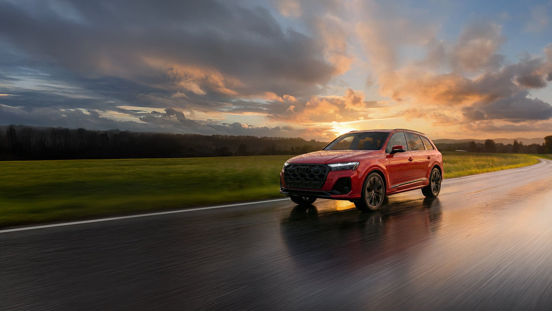 Front profile of an Audi Q7 accelerating.
