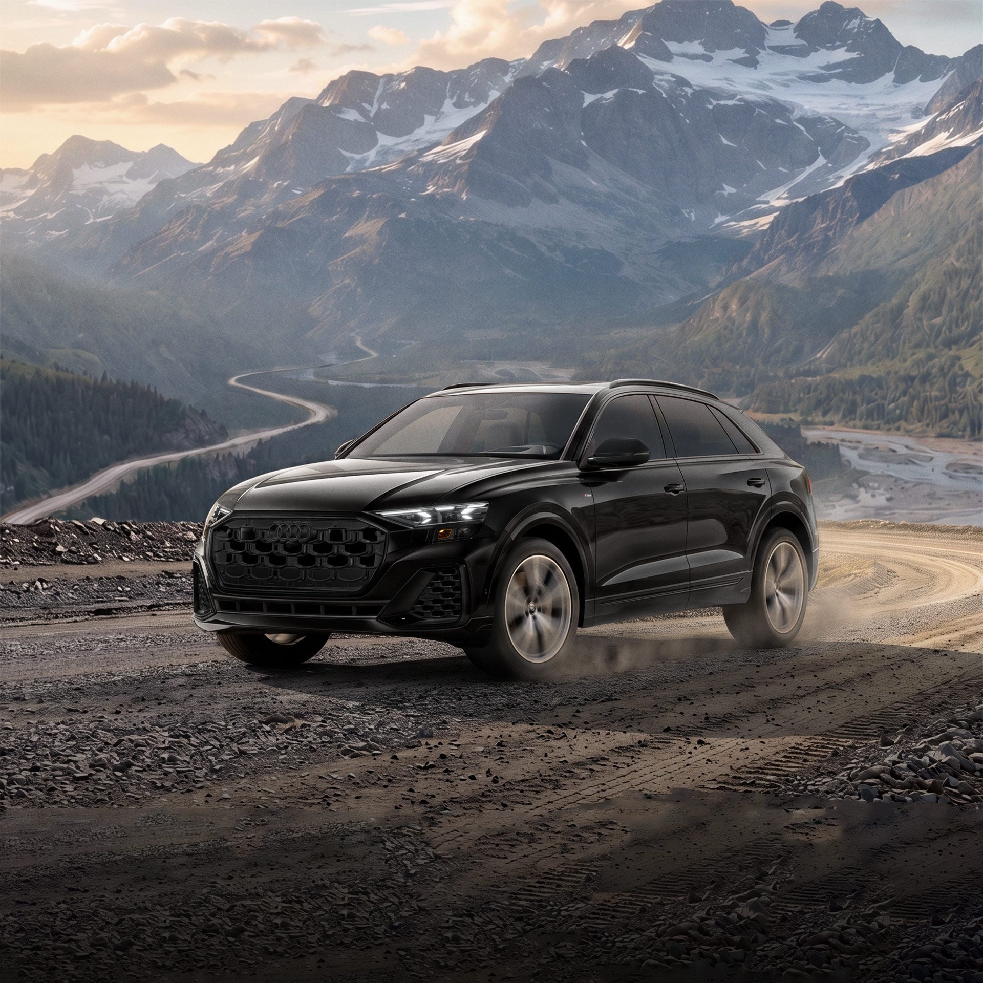 Three-quarter front profile of an Audi Q8 accelerating.
