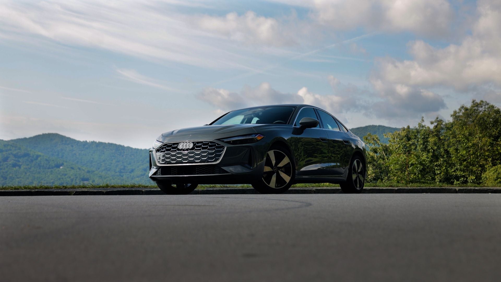 Front view of an new Audi A5 sedan with mountains in the background
