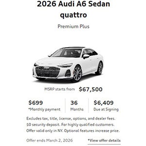 Side view of an Audi A6 driving.