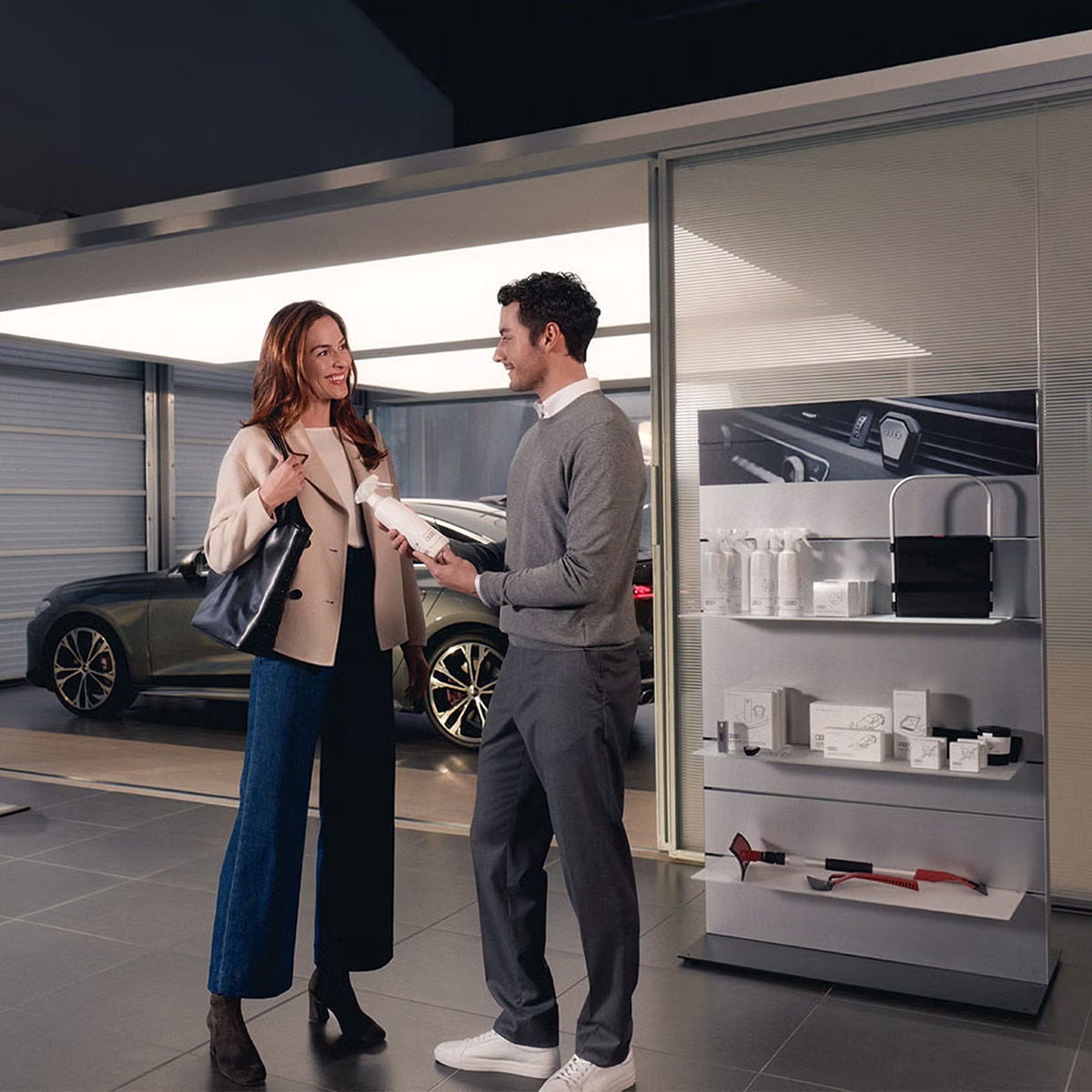 An Audi technician servicing a vehicle.