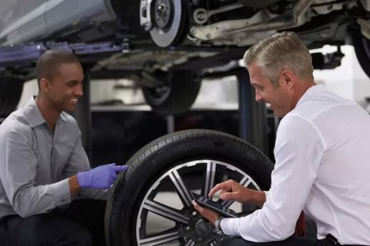 Front profile view of an Audi Q7 accelerating.
