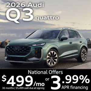 Side view of an Audi Q3 driving.