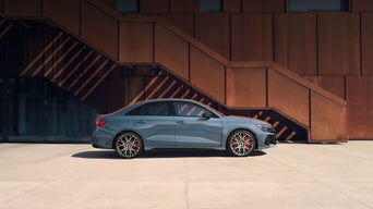 Side profile of the Audi RS 3 parked.