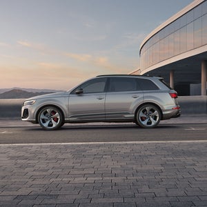 Side view of an Audi Q7 driving.