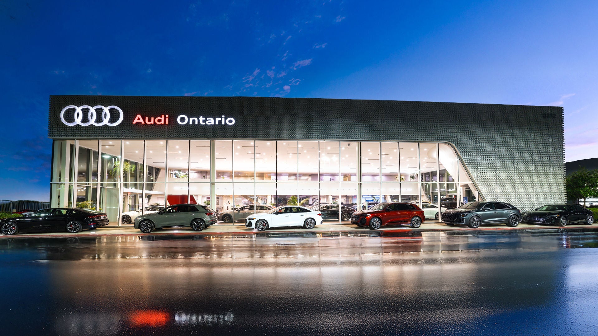 Customer looking at Audi cars in the showroom.