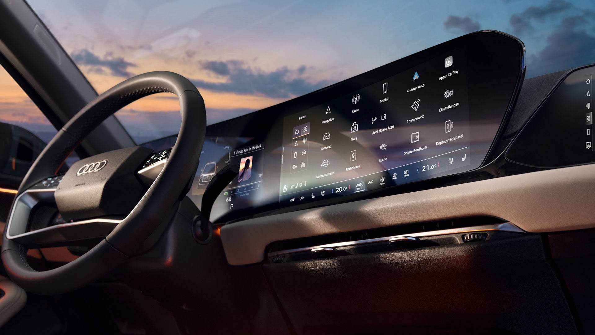 Digitales Display der Audi A5 Limousine mit Menüfunktionen wie Navigation, Medien und Fahrzeugeinstellungen bei Sonnenuntergang.