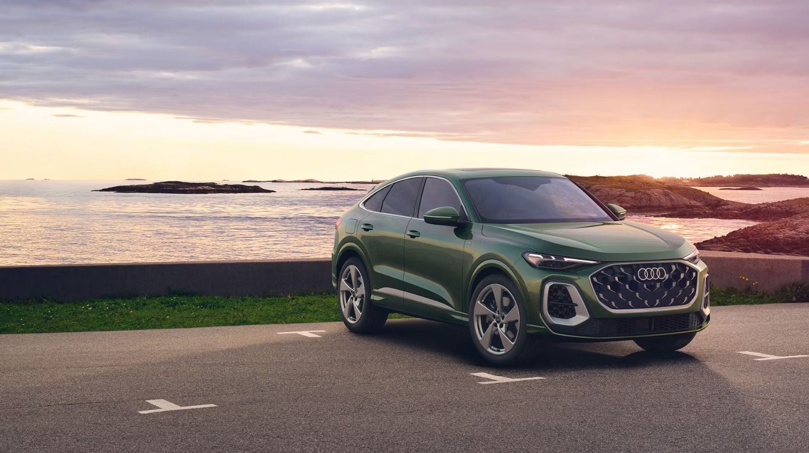 Audi 2025 Audi Q5 left profile driving.