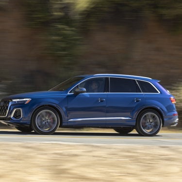 2026 Audi SQ7 biturbo V8 at speed — profile driving action at Audi Sewickley