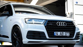 Front profile view of Audi vehicle. 