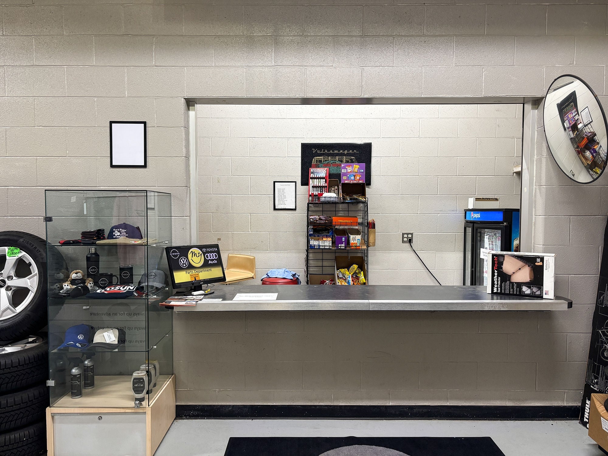 Audi service technician servicing a vehicle.