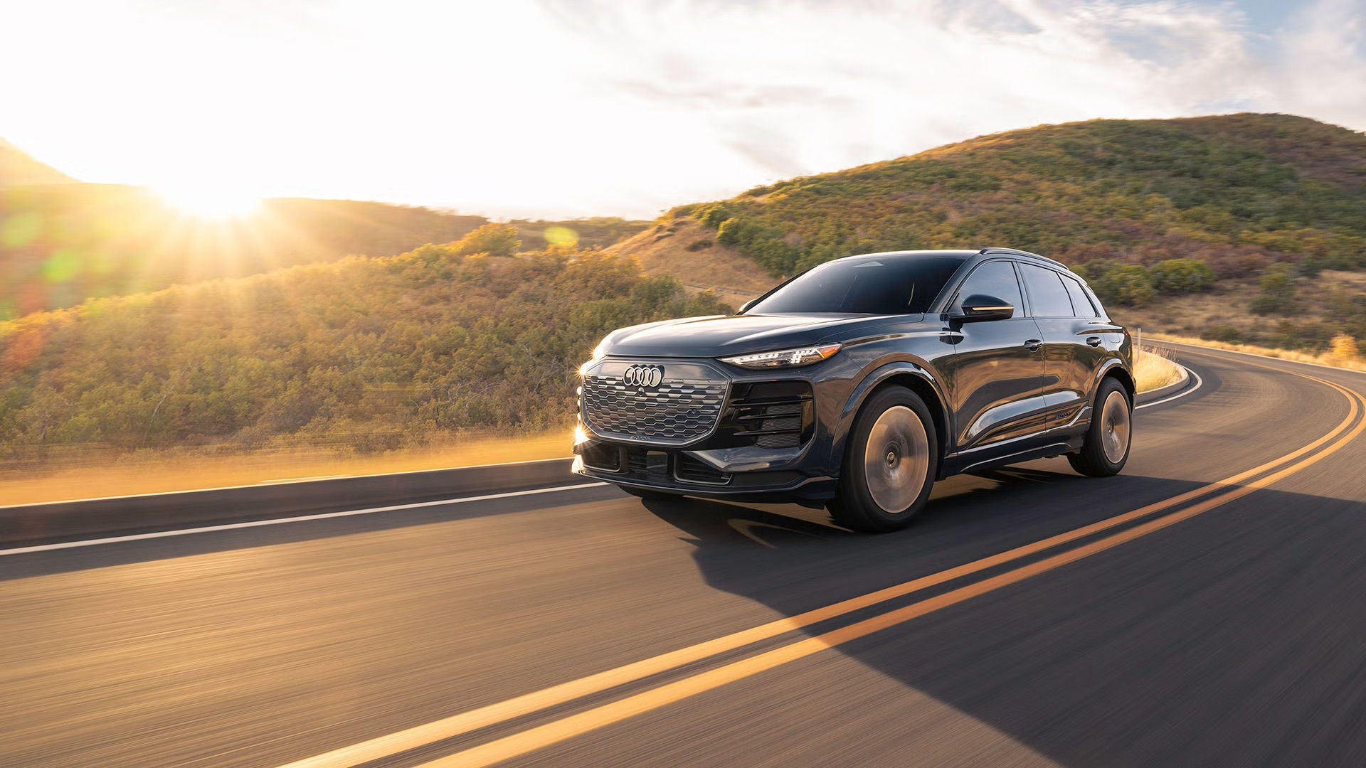 Three-quarter view of Audi Q6 e-tron accelerating.