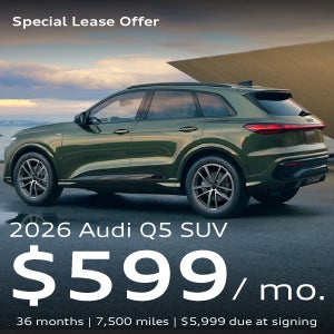 A green Q5 parked.
