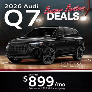 Side view of an Audi Q7 driving.