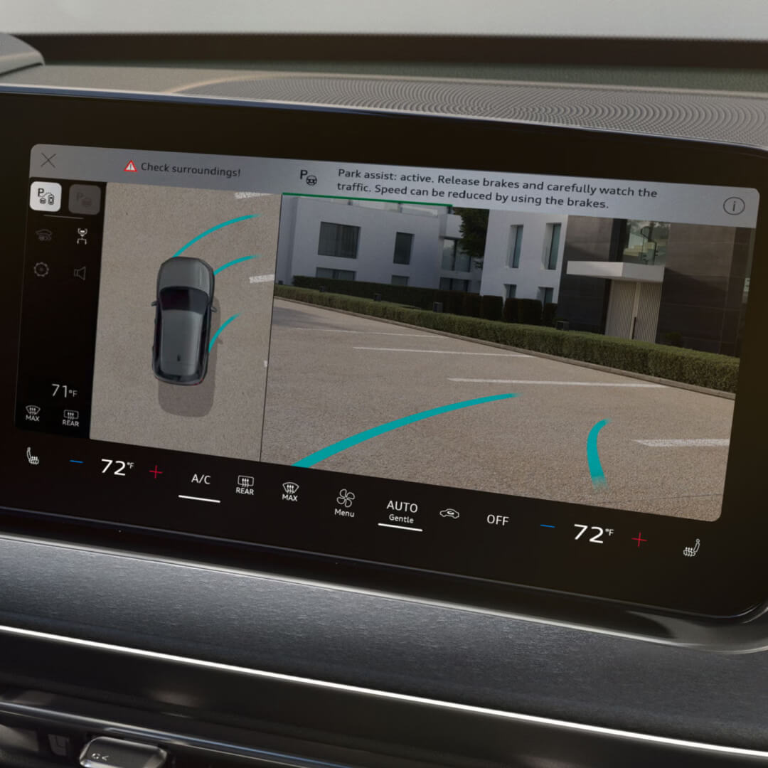 Interior close-up detail shot of an 2027 Audi Q3 screen showing active parking assist with overhead 360 camera.