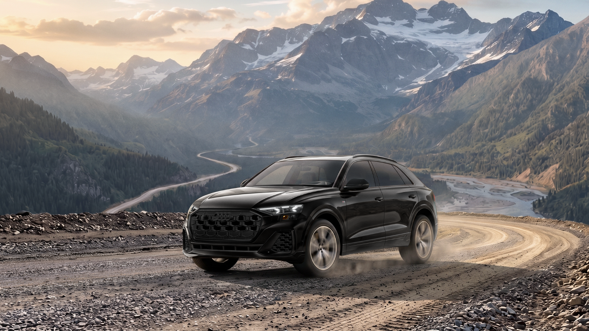 A Q8 on a rocky road with mountains behind