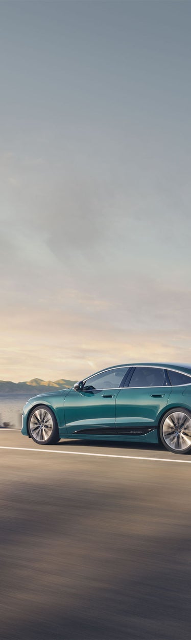 Side view of the Audi S6 Sportback e-tron in motion.