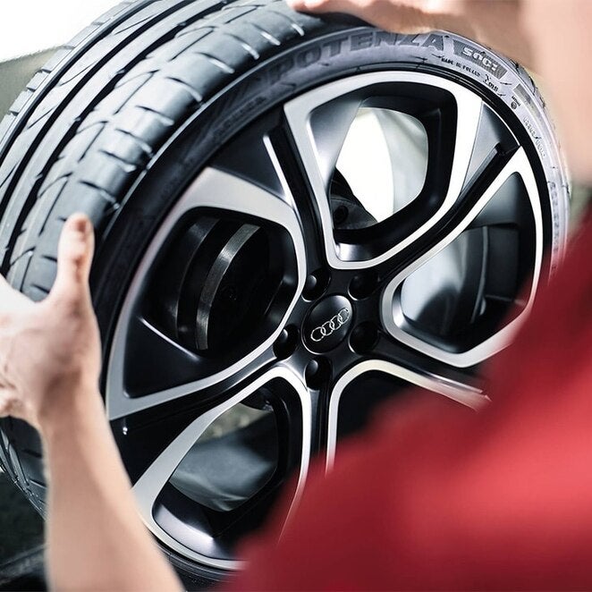 Audi SUV parked outside in winter.