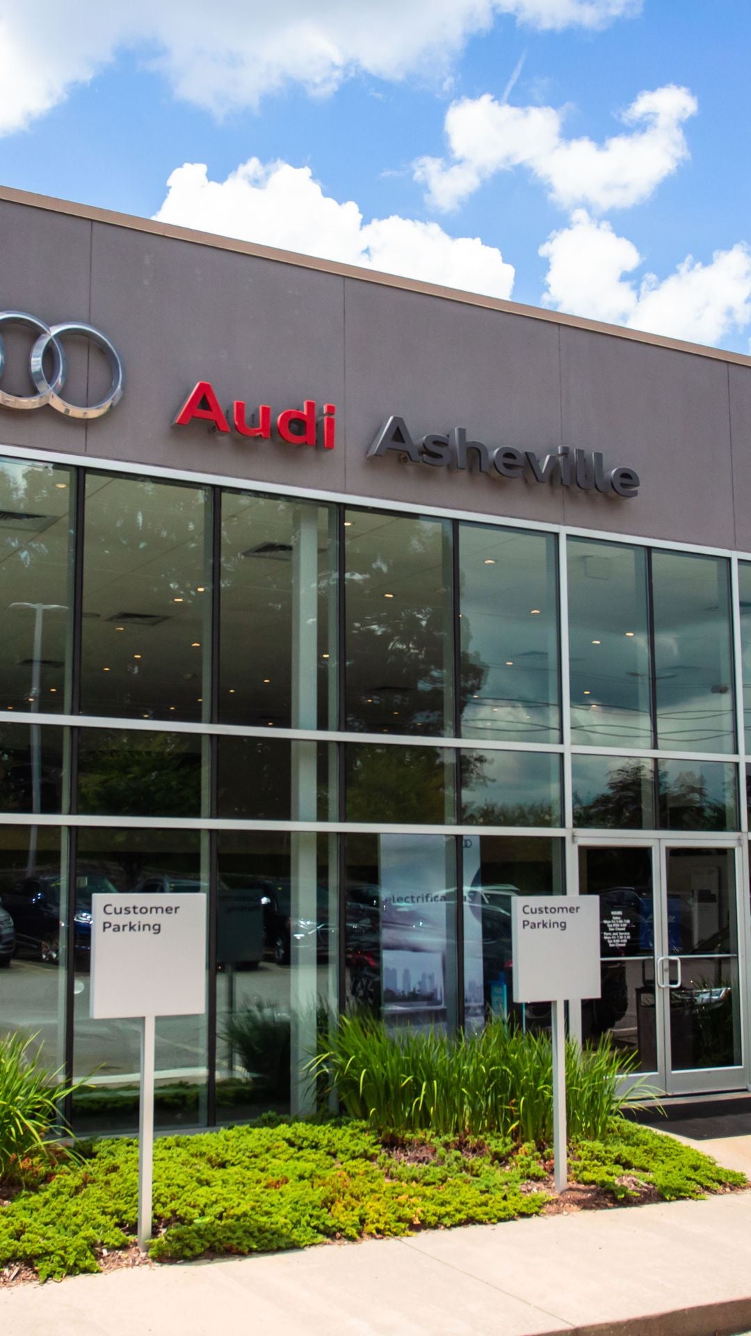 Two people chatting with each other across the charging station.