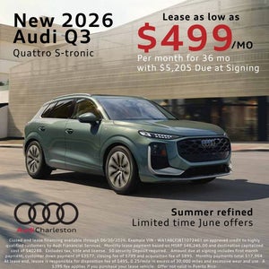 Side view of an Audi Q3 driving.