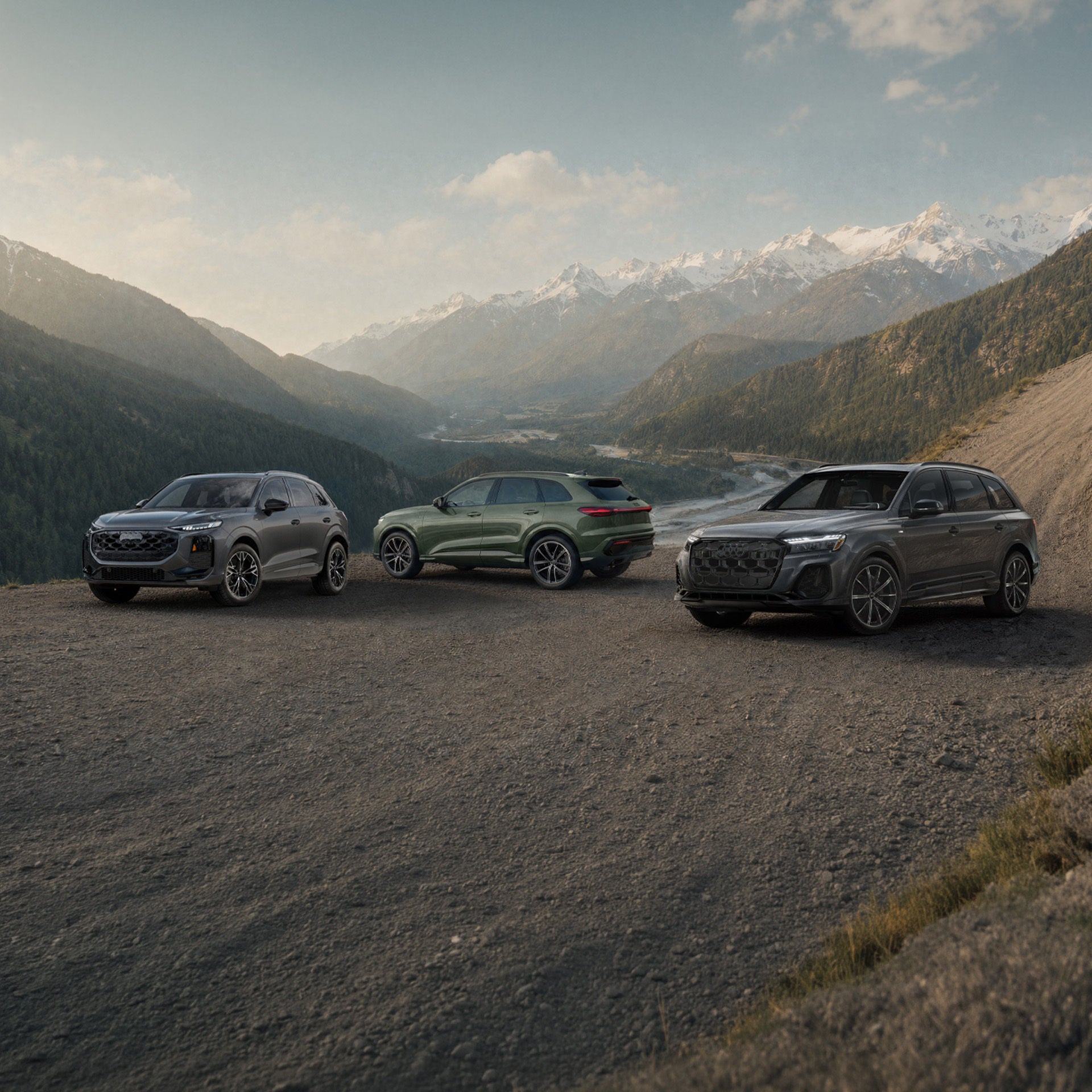 Three Audi cars in profile, side by side.